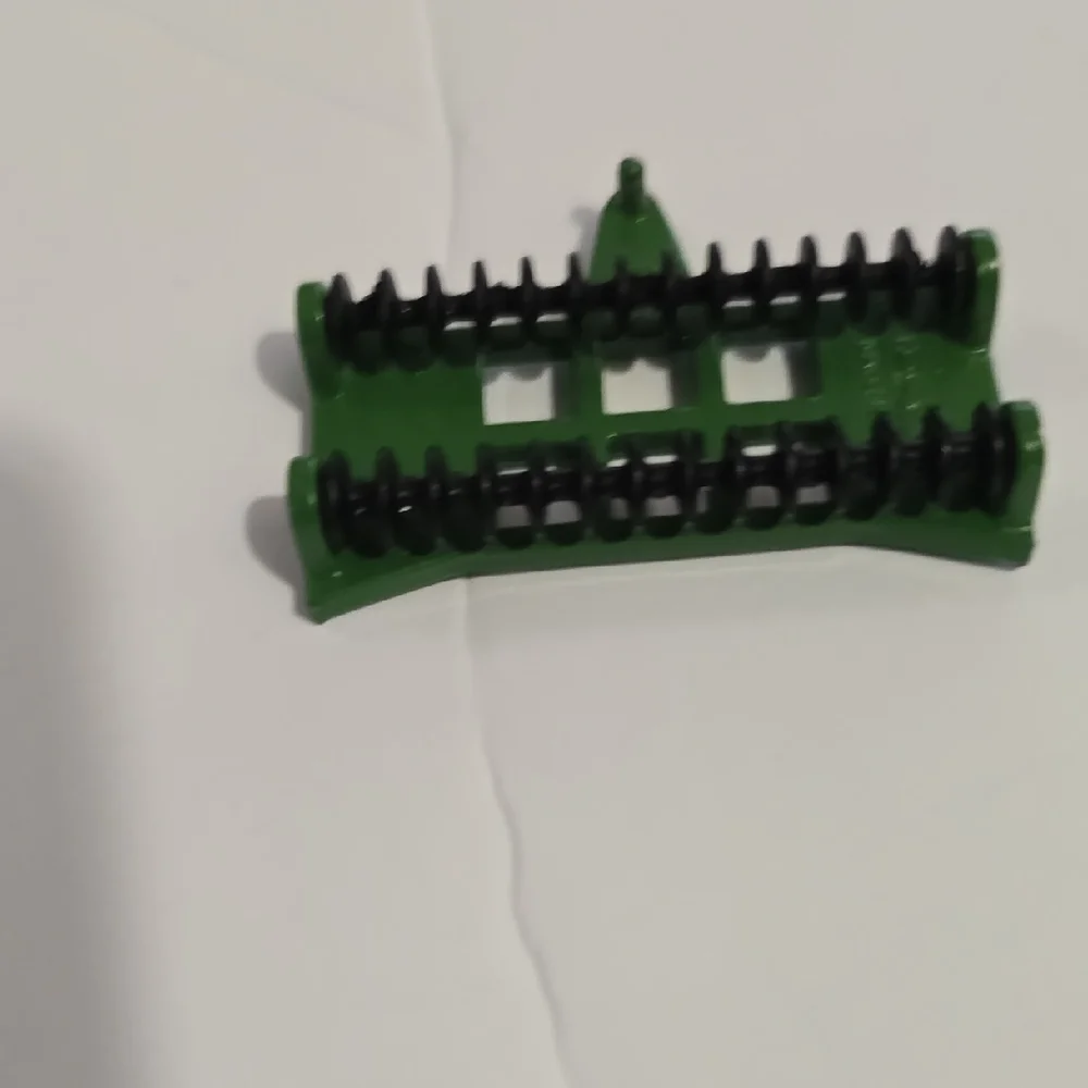 Toy John Deere combine corn head, likely an Ertl 1/64 scale model.